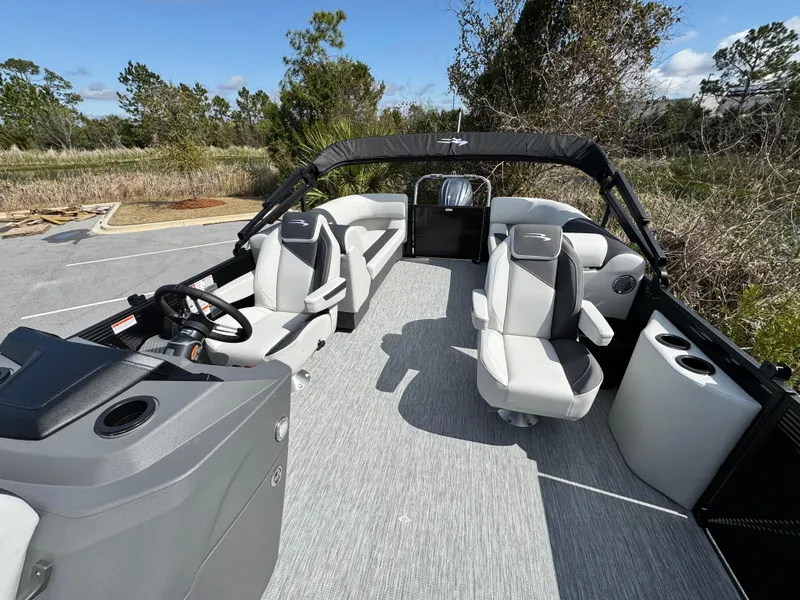 Slide: The Image of 2025 Bennington S Quad Bench 22 SSR pontoon boat with spacious seating and modern design. - 13