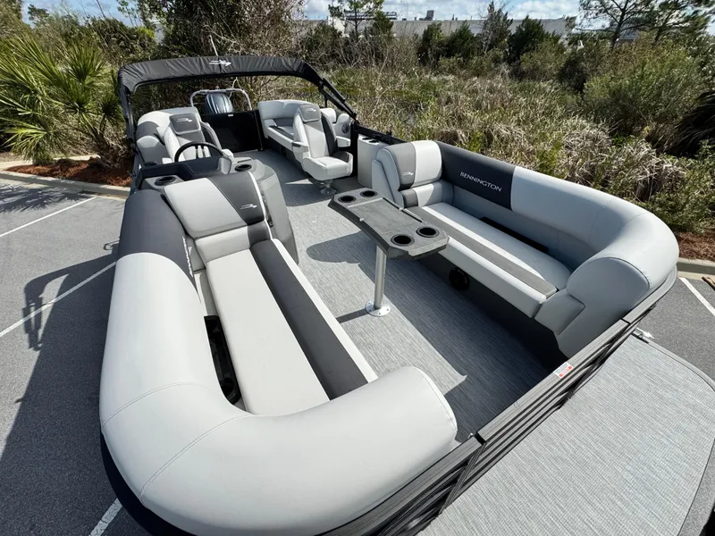 Slide: The Image of 2025 Bennington S Quad Bench 22 SSR pontoon boat with spacious seating and modern design. - 16