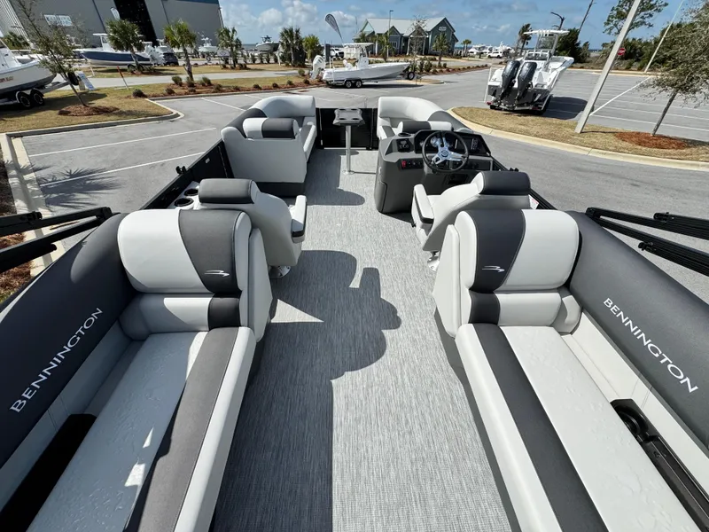 Slide: The Image of 2025 Bennington S Quad Bench 22 SSR pontoon boat with spacious seating and modern design. - 9