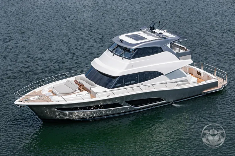 Slide: The Image of 2025 Riviera 64 Sports Motor Yacht cruising on calm waters, showcasing sleek design and luxury features. - 14