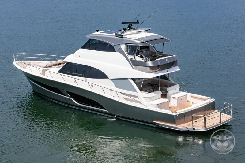 Slide: The Image of 2025 Riviera 64 Sports Motor Yacht cruising on calm waters. - 18