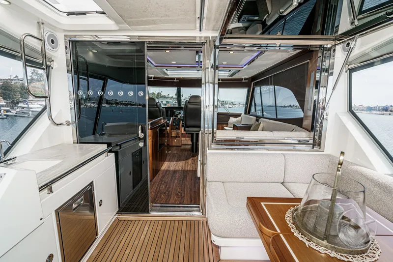 Slide: The Image of Luxurious interior of 2025 Riviera 64 Sports Motor Yacht with modern design and waterfront view. - 27