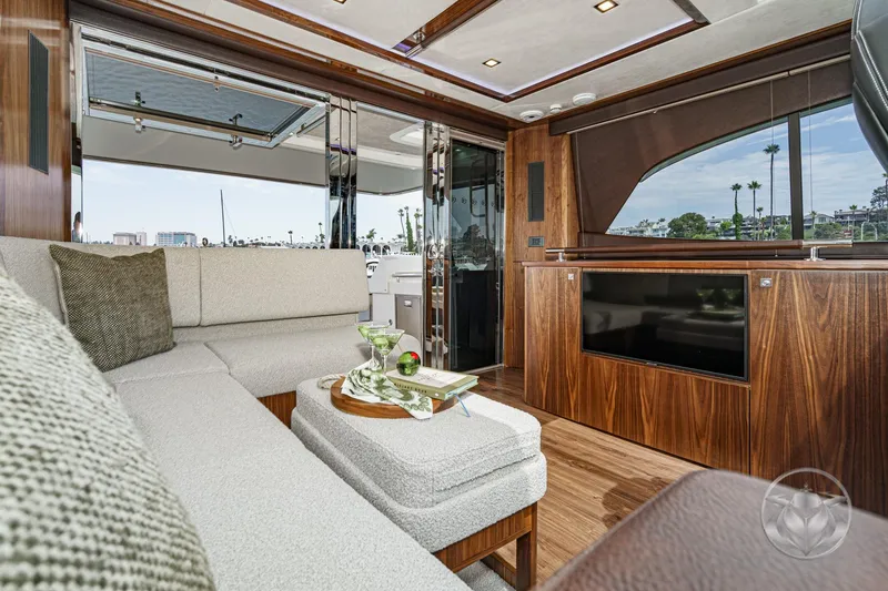 Slide: The Image of Luxurious interior of 2025 Riviera 64 Sports Motor Yacht with elegant wood finishes. - 28