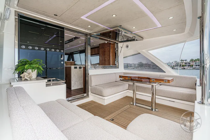 Slide: The Image of Luxurious interior of 2026 Riviera 64 Sports Motor Yacht with elegant seating and modern design. - 35