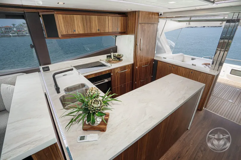 Slide: The Image of Luxurious interior of 2025 Riviera 64 Sports Motor Yacht with modern kitchen design. - 37