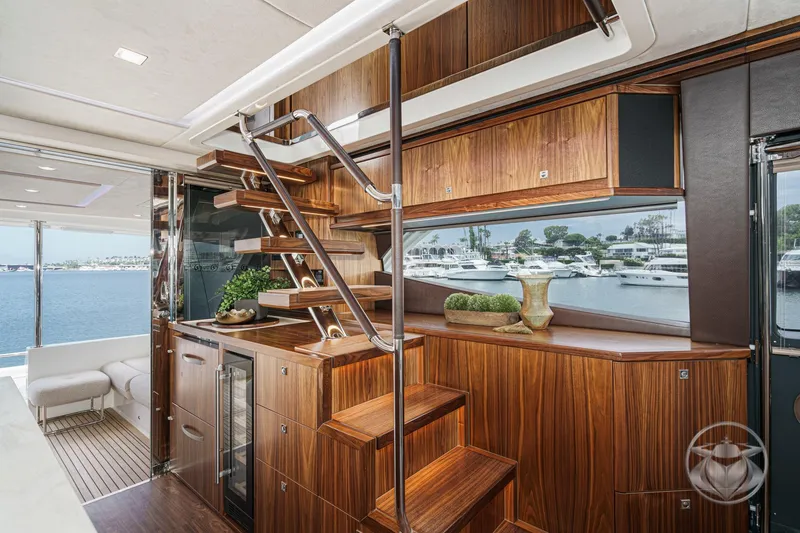 Slide: The Image of Luxurious interior of 2025 Riviera 64 Sports Motor Yacht with elegant wood finishes. - 38