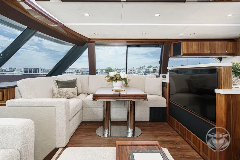Slide: The Image of Luxurious interior of 2025 Riviera 64 Sports Motor Yacht with elegant seating and modern decor. - 42
