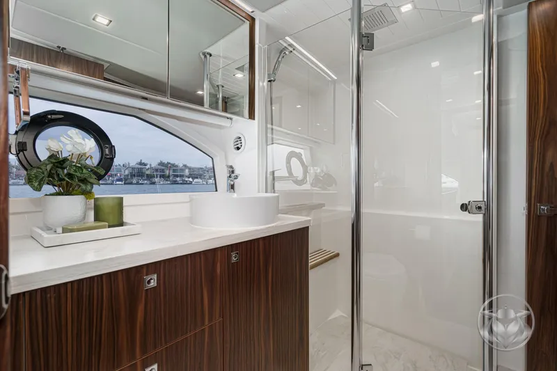 Slide: The Image of Luxurious bathroom interior of 2025 Riviera 64 Sports Motor Yacht with modern fixtures. - 46