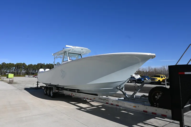 Slide: The Image of 2021 Onslow Bay 41 Tournament Edition boat cruising on open water. - 0