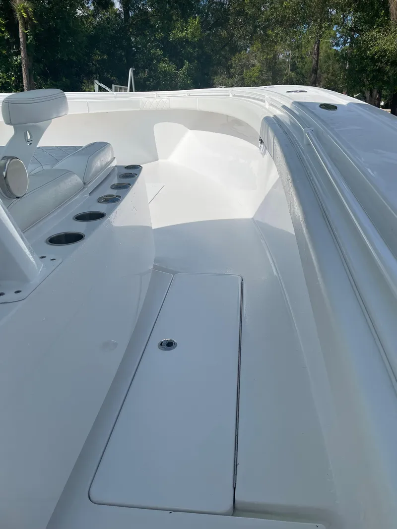 Slide: The Image of Luxurious seating on 2021 Onslow Bay 41 Tournament Edition boat, with ocean backdrop. - 11