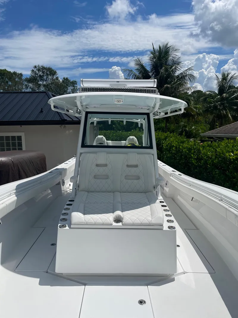 Slide: The Image of 2021 Onslow Bay 41 Tournament Edition boat on calm ocean waters under clear blue sky. - 13
