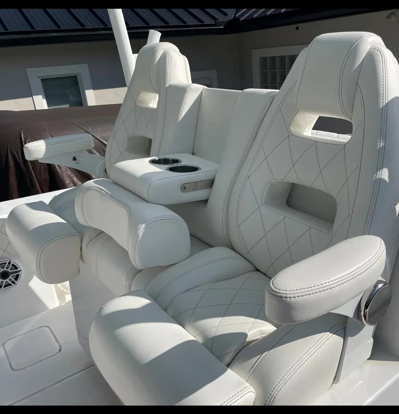 Slide: The Image of 2021 Onslow Bay 41 Tournament Edition boat on open water, featuring four engines. - 15