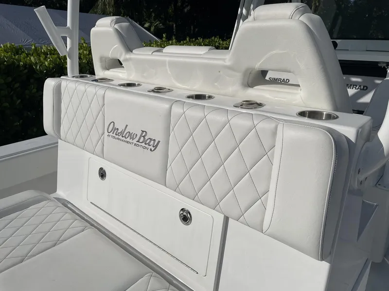 Slide: The Image of 2021 Onslow Bay 41 Tournament Edition boat interior with toilet and seating. - 17