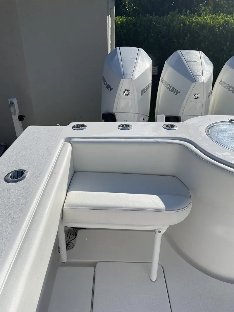 Slide: The Image of 2021 Onslow Bay 41 Tournament Edition boat on trailer, parked outdoors under clear blue sky. - 18