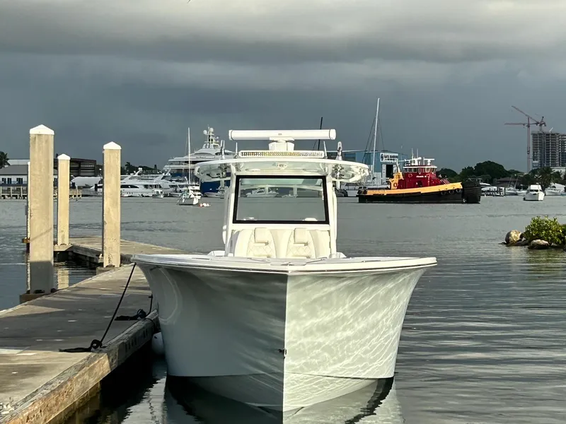 Slide: The Image of 2021 Onslow Bay 41 Tournament Edition boat on open water, featuring four powerful engines. - 3