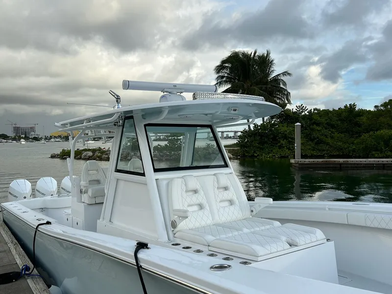 Slide: The Image of 2021 Onslow Bay 41 Tournament Edition boat on open water, featuring multiple outboard engines. - 5