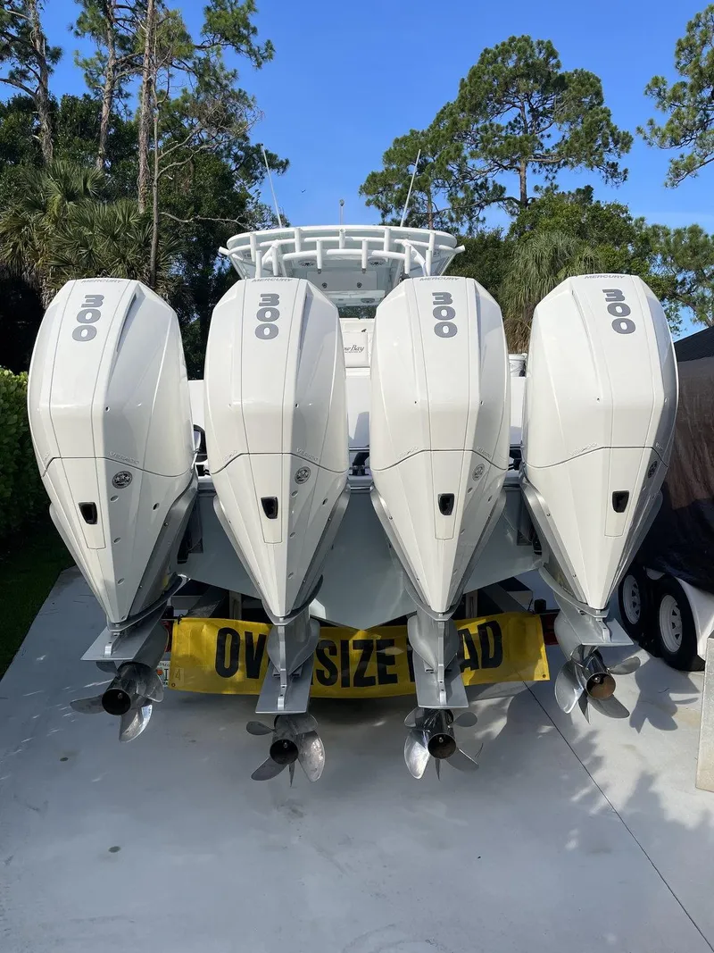 Slide: The Image of 2021 Onslow Bay 41 Tournament Edition with four Mercury outboard engines on open water. - 7