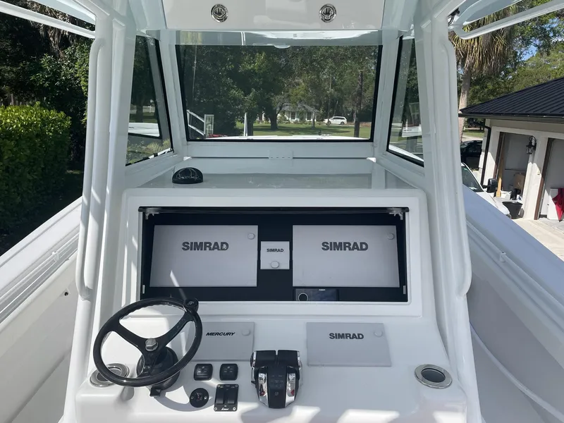 Slide: The Image of 2021 Onslow Bay 41 Tournament Edition boat cockpit with advanced navigation systems. - 8