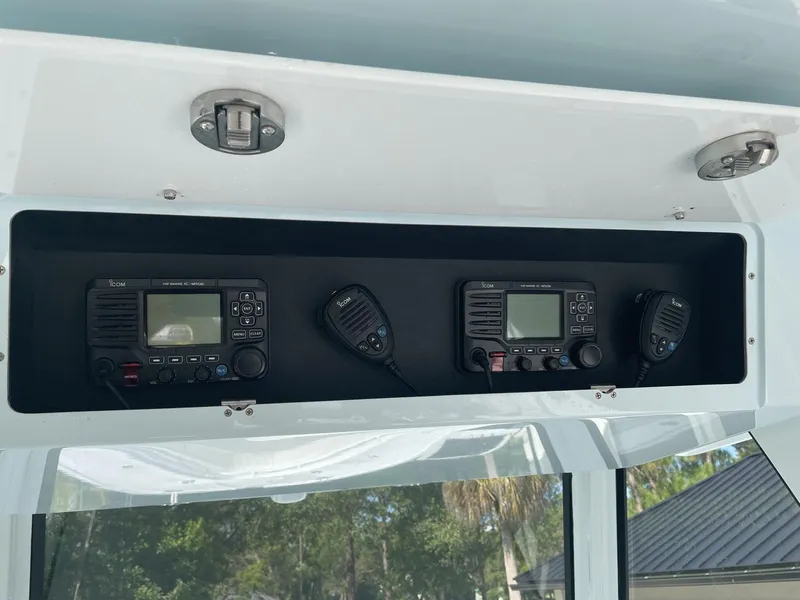 Slide: The Image of Luxurious 2021 Onslow Bay 41 Tournament Edition boat interior with white seating on open water. - 9