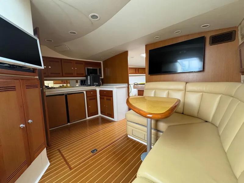 Slide: The Image of Luxurious interior of 2005 Cabo 40 Hardtop Express yacht with leather seating and modern amenities. - 17