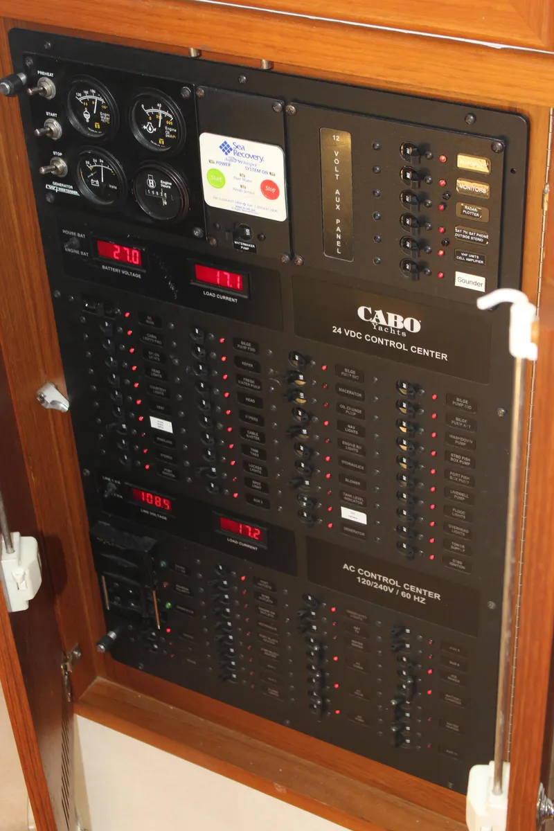 Slide: The Image of Electrical control panel of a 2005 Cabo 40 Hardtop Express boat. - 22