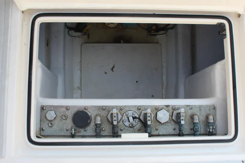 Slide: The Image of Control panel inside 2005 Cabo 40 Hardtop Express boat compartment. - 24