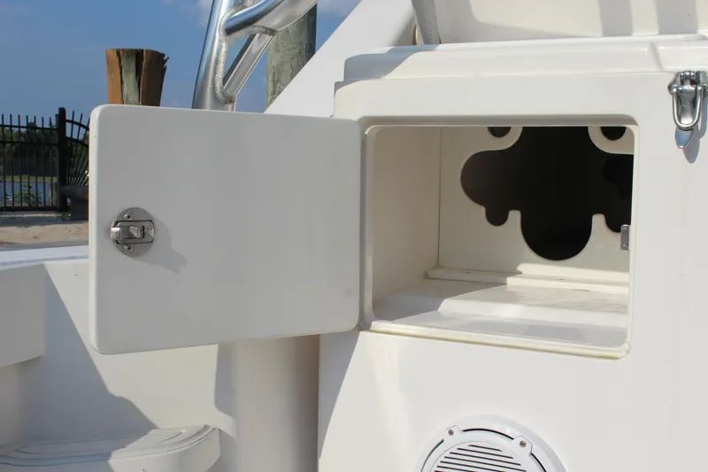 Slide: The Image of Open storage compartment on 2005 Cabo 40 Hardtop Express boat. - 26