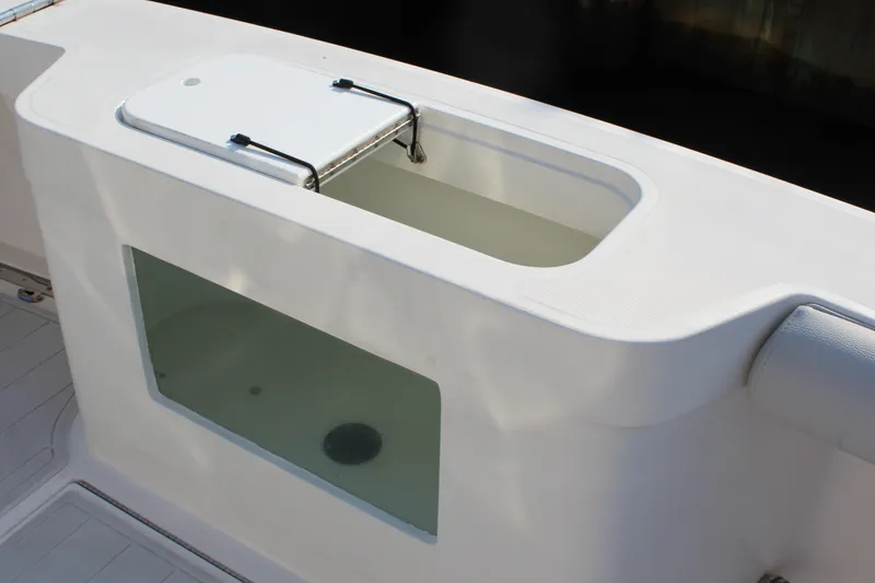 Slide: The Image of Livewell on 2005 Cabo 40 Hardtop Express boat, featuring a transparent viewing window. - 29