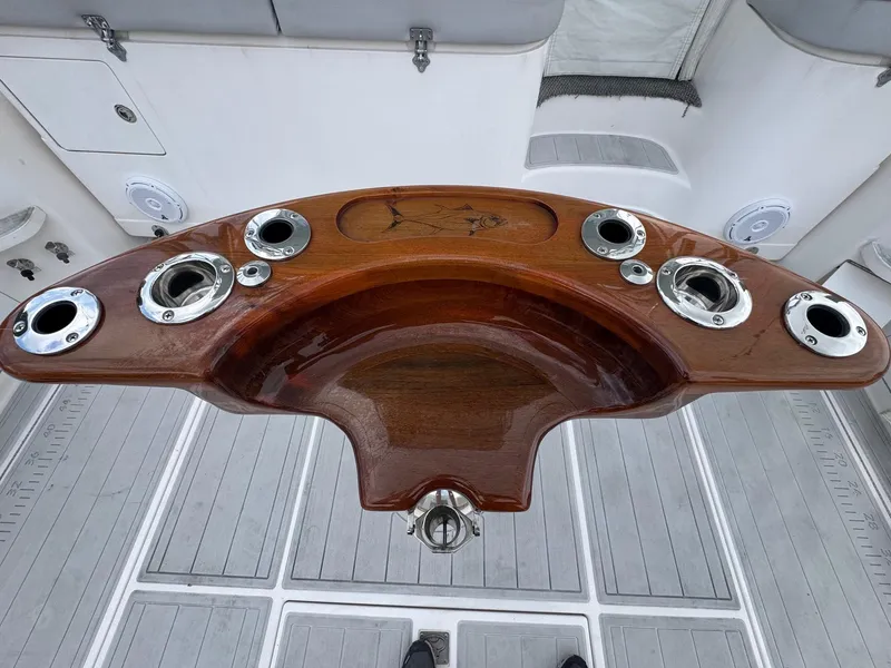 Slide: The Image of Wooden helm station on a 2005 Cabo 40 Hardtop Express boat. - 9