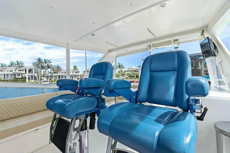 Slide: The Image of Luxurious boat interior with blue captain chairs and waterfront view. - 10