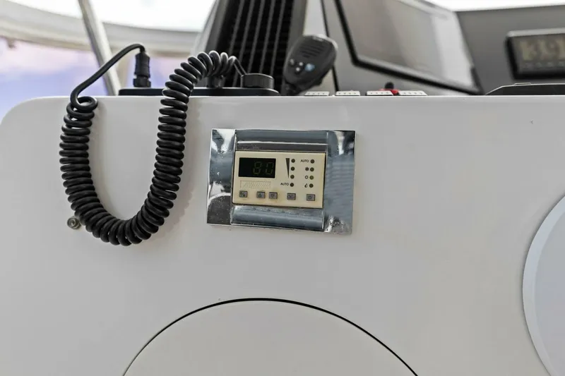 Slide: The Image of Control panel with coiled cable on a white surface, possibly in a vehicle or boat. - 14