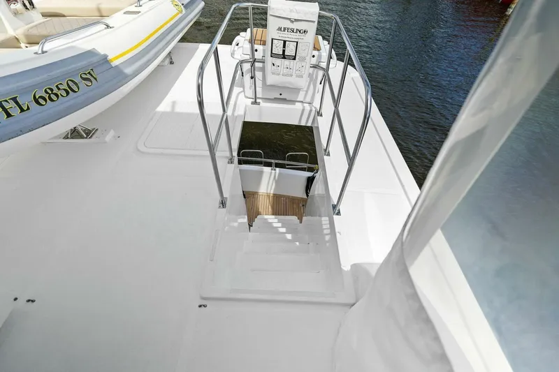 Slide: The Image of Staircase on a boat deck with railing, overlooking water. - 16