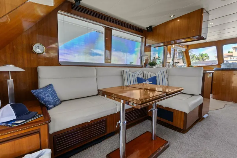 Slide: The Image of Luxurious yacht interior with plush seating and wooden table, featuring nautical decor. - 20