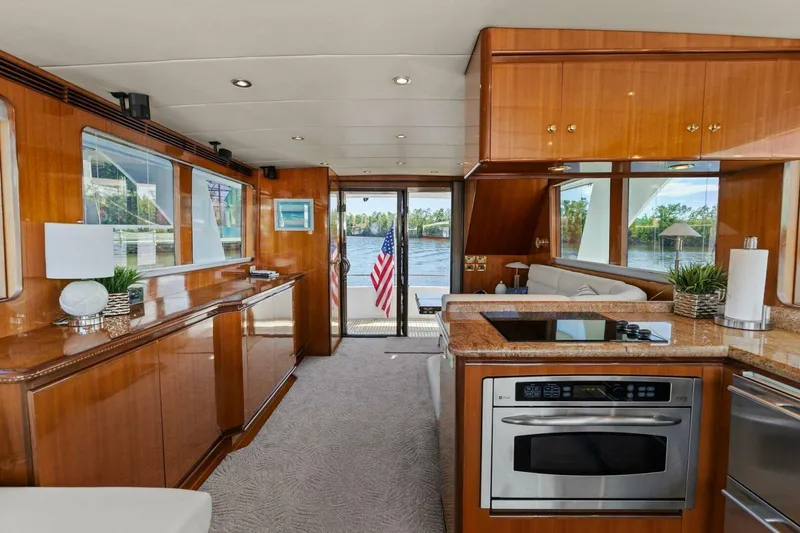 Slide: The Image of Luxurious yacht interior with modern kitchen and scenic water view. - 28