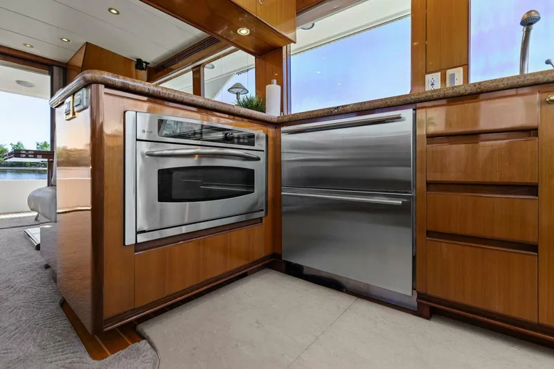 Slide: The Image of Modern yacht kitchen with stainless steel appliances and wooden cabinetry. - 33