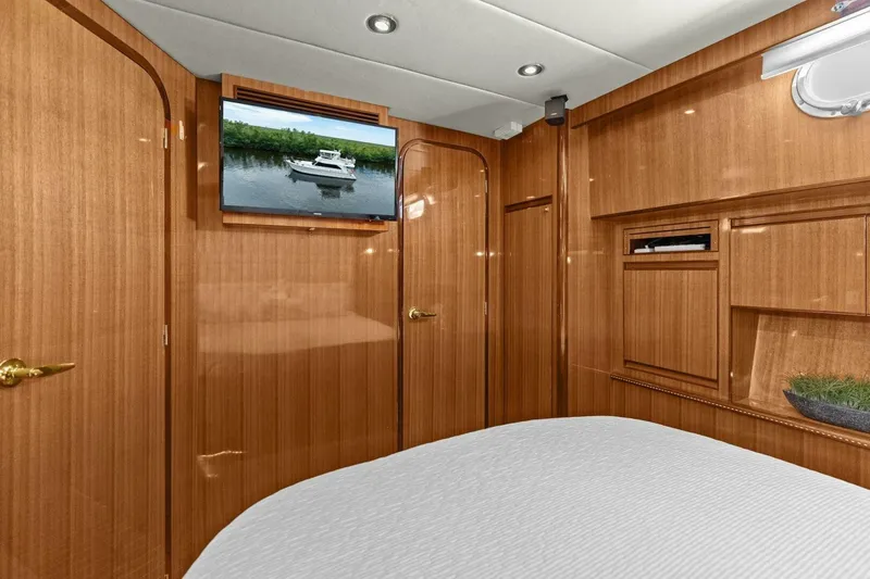 Slide: The Image of Luxurious wooden interior with TV and bed in a yacht cabin. - 40