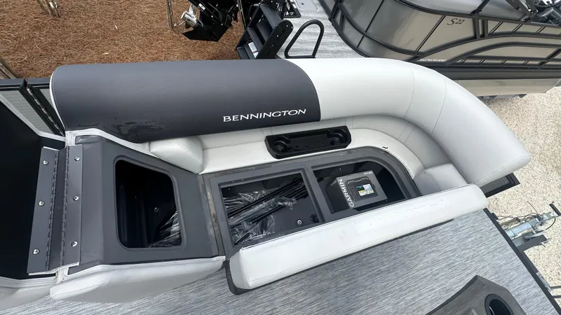 Slide: The Image of 2025 Bennington S Quad Bench 22 SSR boat seating with storage compartments and sleek design. - 12