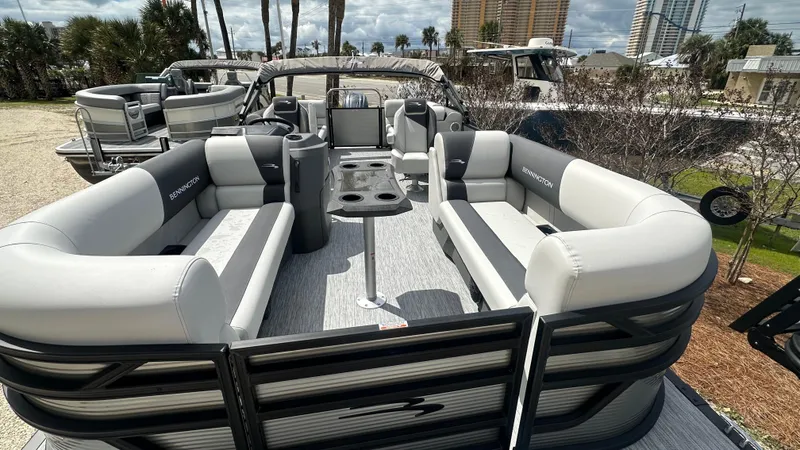 Slide: The Image of 2025 Bennington S Quad Bench 22 SSR pontoon boat with spacious seating and modern design. - 3