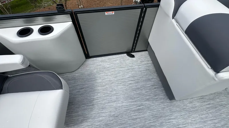 Slide: The Image of Interior of 2025 Bennington S Quad Bench 22 SSR pontoon boat with seating and cup holders. - 7