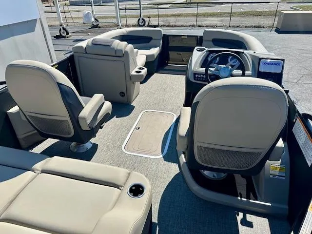 Slide: The Image of 2023 Barletta C20UC boat interior with beige seating and modern dashboard. - 11