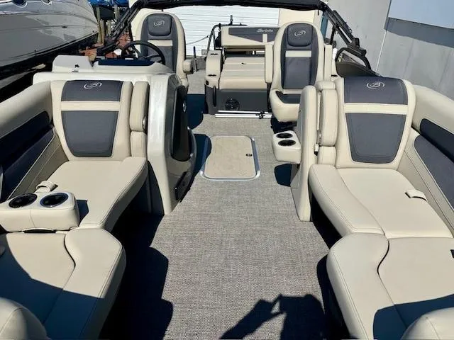 Slide: The Image of 2023 Barletta C20UC pontoon boat interior with beige and gray seating. - 4