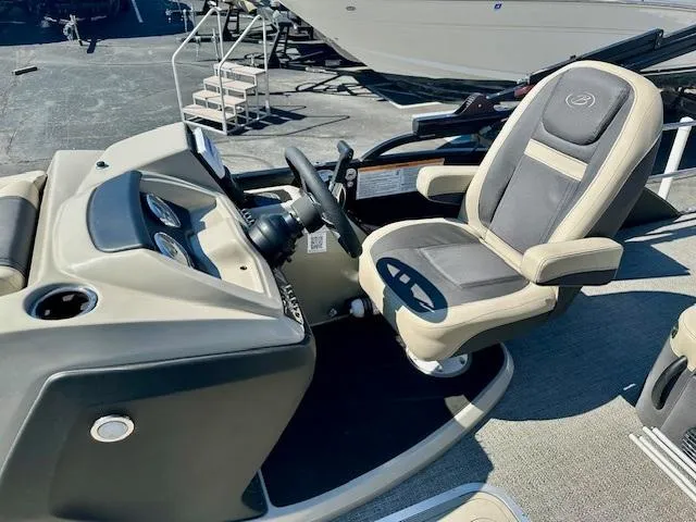Slide: The Image of 2023 Barletta C20UC boat interior with steering console and captain's chair. - 5