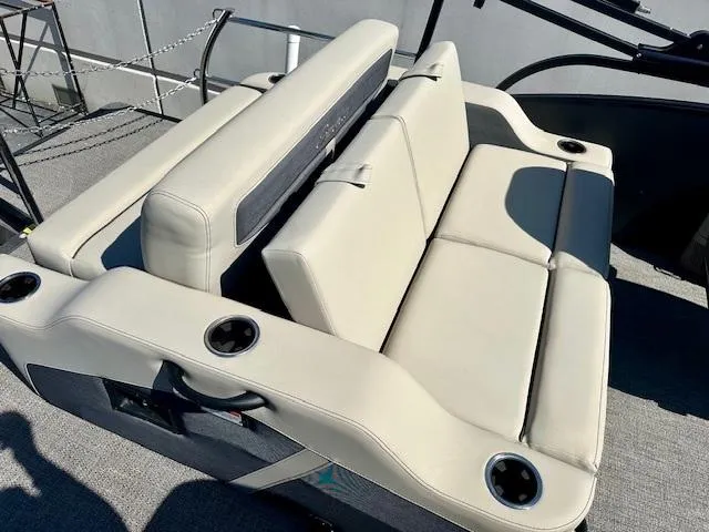 Slide: The Image of 2023 Barletta C20UC boat seating with beige upholstery and cup holders. - 8