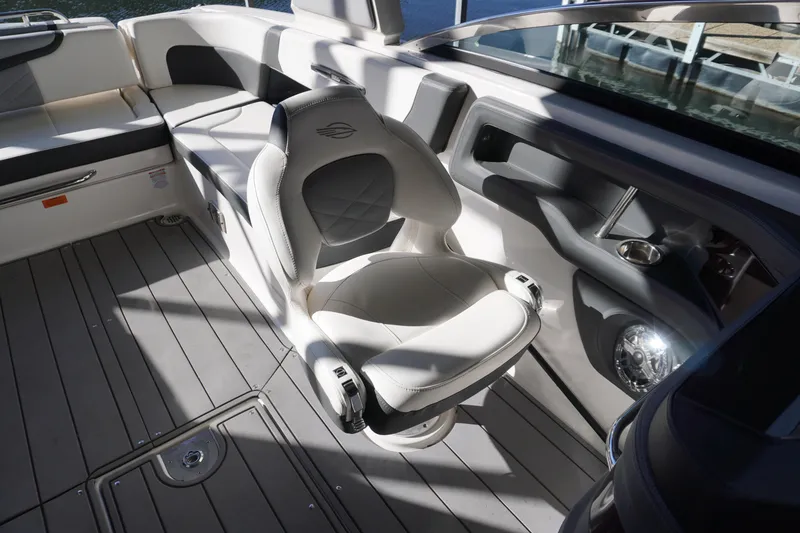 Slide: The Image of 2022 Chaparral 287 SSX boat interior with luxurious seating and modern design. - 10