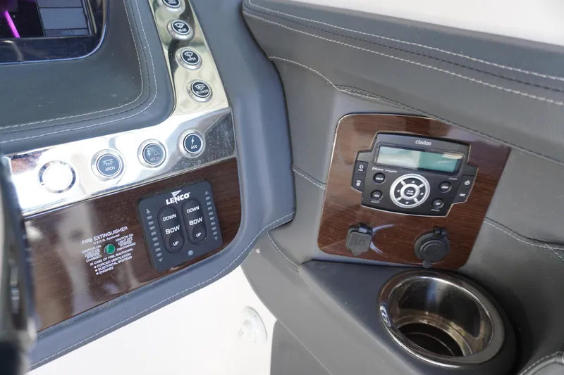 Slide: The Image of 2022 Chaparral 287 SSX dashboard with control panel and stereo system. - 17