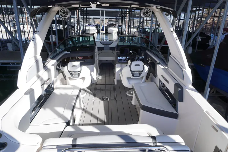 Slide: The Image of 2022 Chaparral 287 SSX boat interior with luxurious seating and modern dashboard. - 6