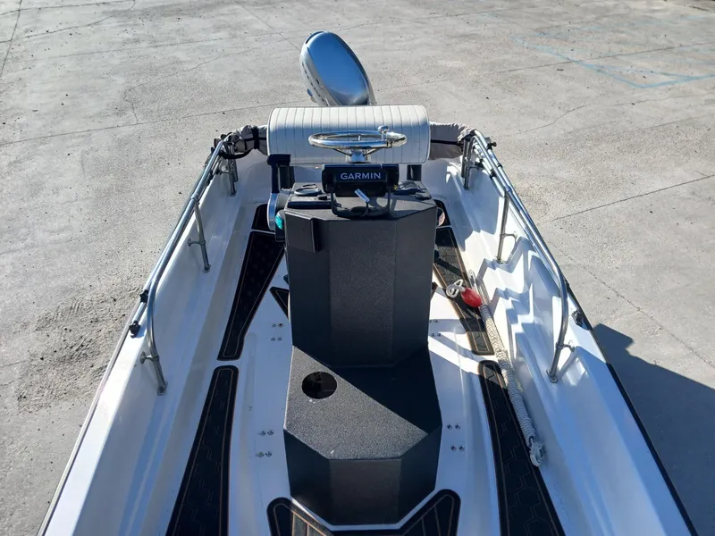 Slide: The Image of 1980 Boston Whaler 15 Montauk boat on trailer in outdoor storage area. - 2
