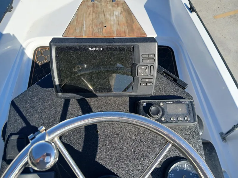 Slide: The Image of 1980 Boston Whaler 15 Montauk boat with Honda outboard motor on a trailer. - 4