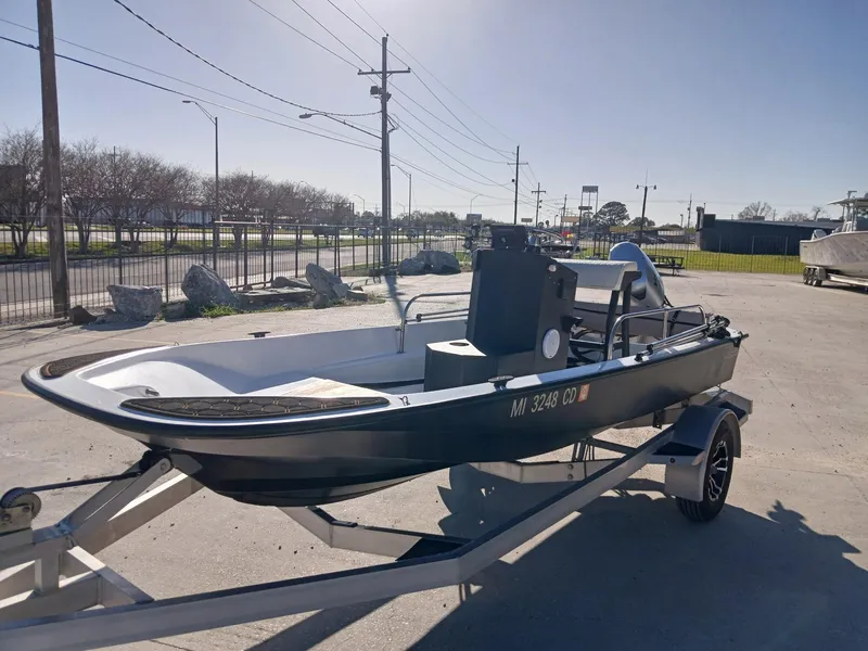 Slide: The Image of 1980 Boston Whaler 15 Montauk boat interior with Garmin equipment, viewed from above. - 8