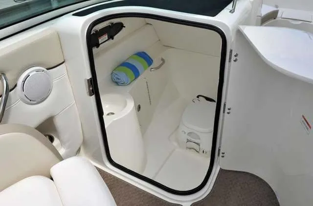 Slide: The Image of Interior of 2012 Sea Ray 260 Sundeck boat with compact bathroom and towel storage. - 6